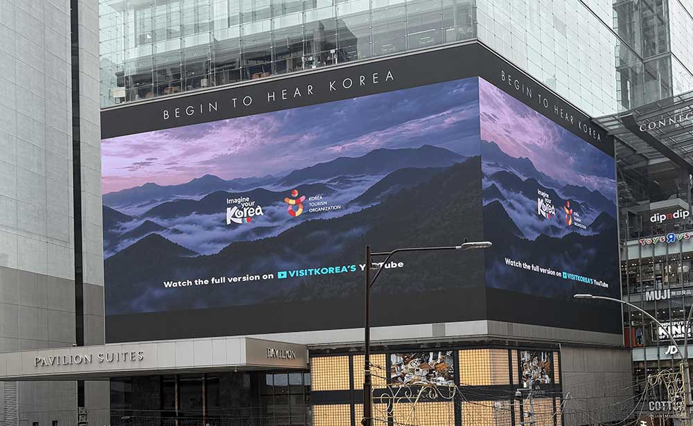 Korea Tourism “Begin to Hear Korea” campaign on a wraparound corner LED screen beside Pavilion in Malaysia