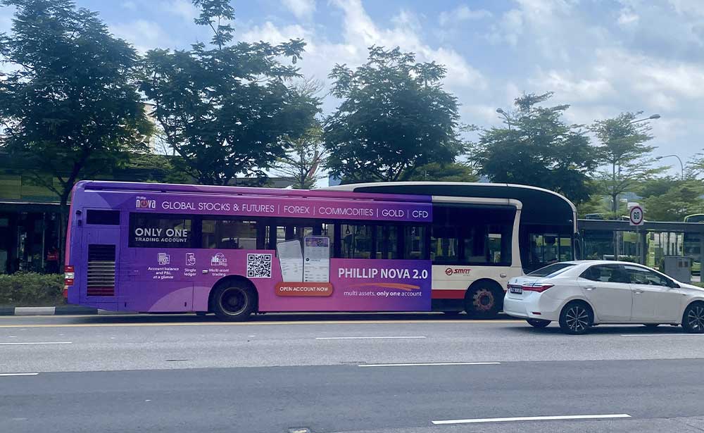 Phillip Nova bus advertising wrap on a public bus travelling along a Singapore road