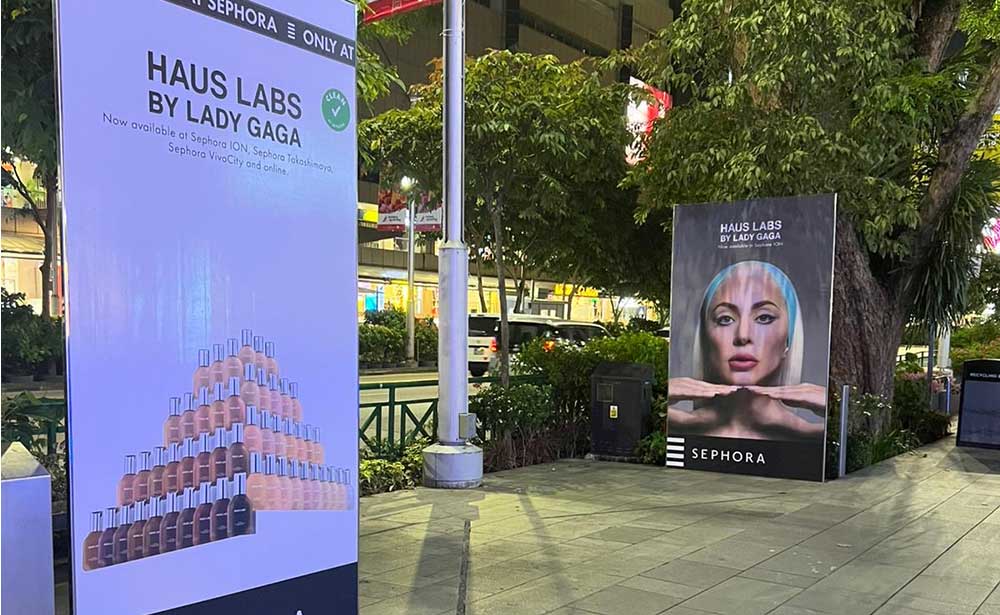 Haus Labs by Lady Gaga ads wrapped on art glass panels along Orchard Road, Singapore