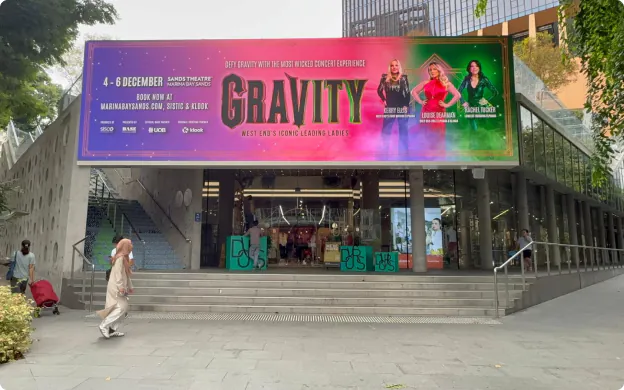 Large-format digital billboard at Design Orchard, Singapore, advertising the GRAVITY concert