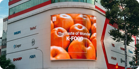 K-Food ad on a curved LED screen in Ho Chi Minh City, Vietnam