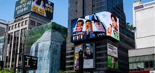 Digital billboards on building façades in a busy district of Seoul, South Korea